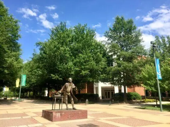 A bronze statue in the courtyard of George Mason University.