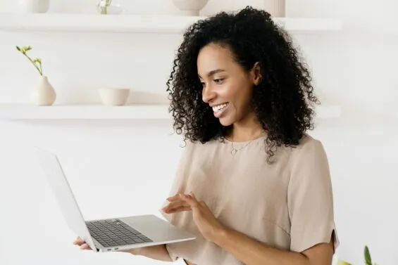 A woman uses her laptop.